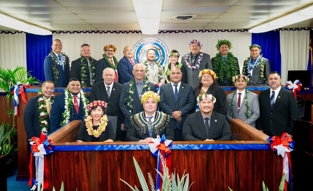 The members of the 24th House of Representatives pose for a photo in the House chamber.