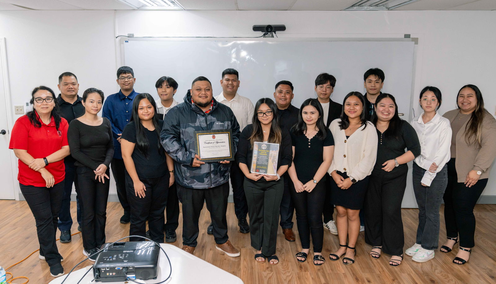 Northern Marianas College Business students present findings from their Business Cooperative Education project on “Tracking the Cost of Wellness” to Rep. Thomas John “TJ” Manglona and School of Business Interim Director & Associate Professor Dr. Barbara “Bobbie” Hunter.NMC photo
