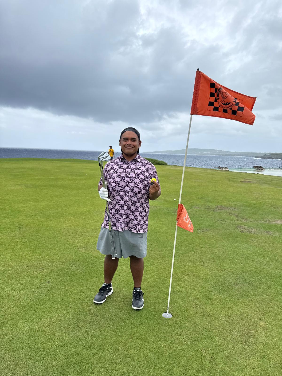 Patrick Fitial at Kingfisher Golf Links hole# 15 holding his lucky ball.