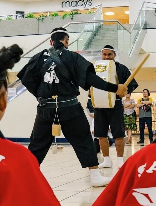 Zac Sakisat and Coddie Forbes perform at the Micronesia Mall.