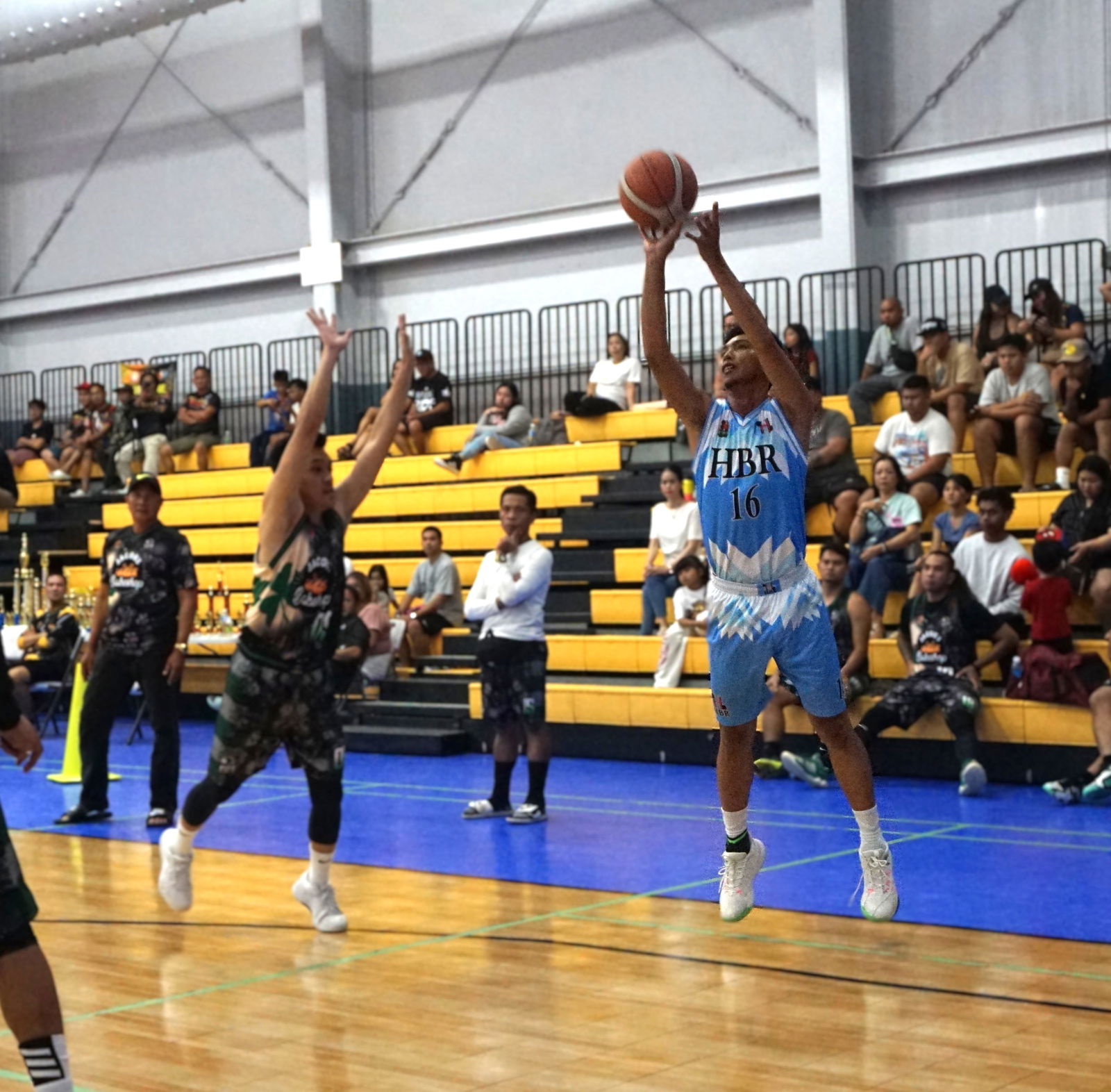 HBR Construction’s JR Galang pulls up for the three-point shot during the championship game against Jacob’s Bakery in the Alpha Kappa Rho 1st Semi-Open Invitational Basketball League 2025 at the Gilbert C. Ada Gymnasium on Sunday night.Photo by James F. Sablan Jr.