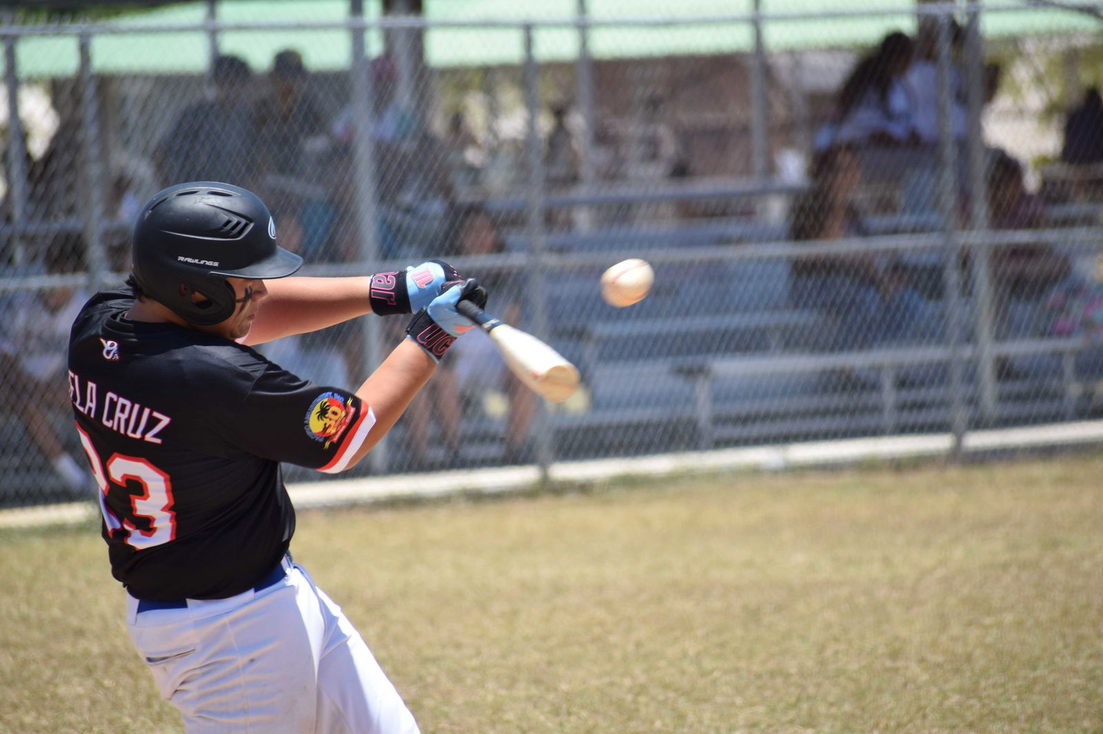 Ol’ Aces’ pitcher Hunter Dela Cruz hits the ball for a single.
