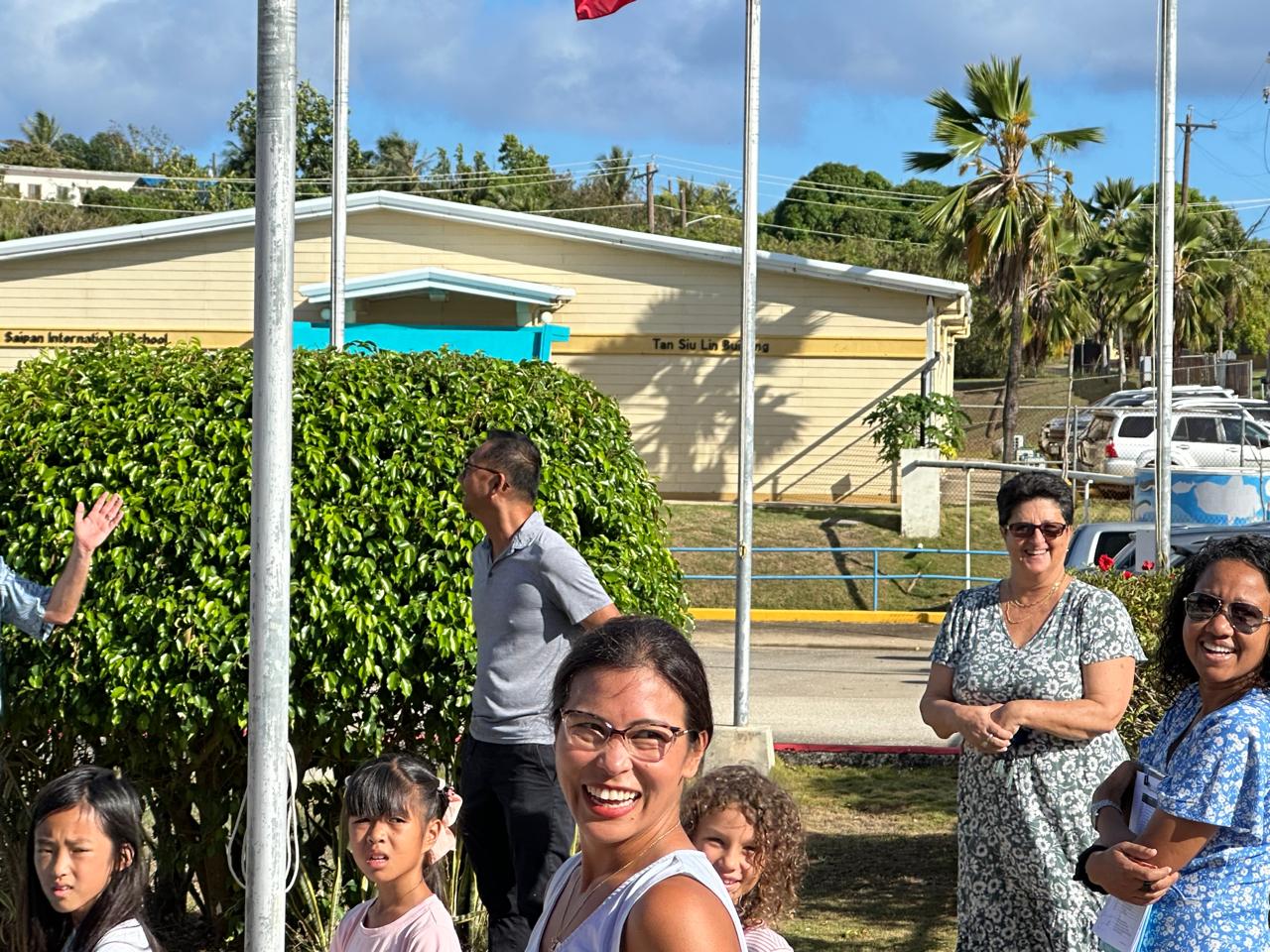 Teachers and students look on as Ms. Mili is honored.
