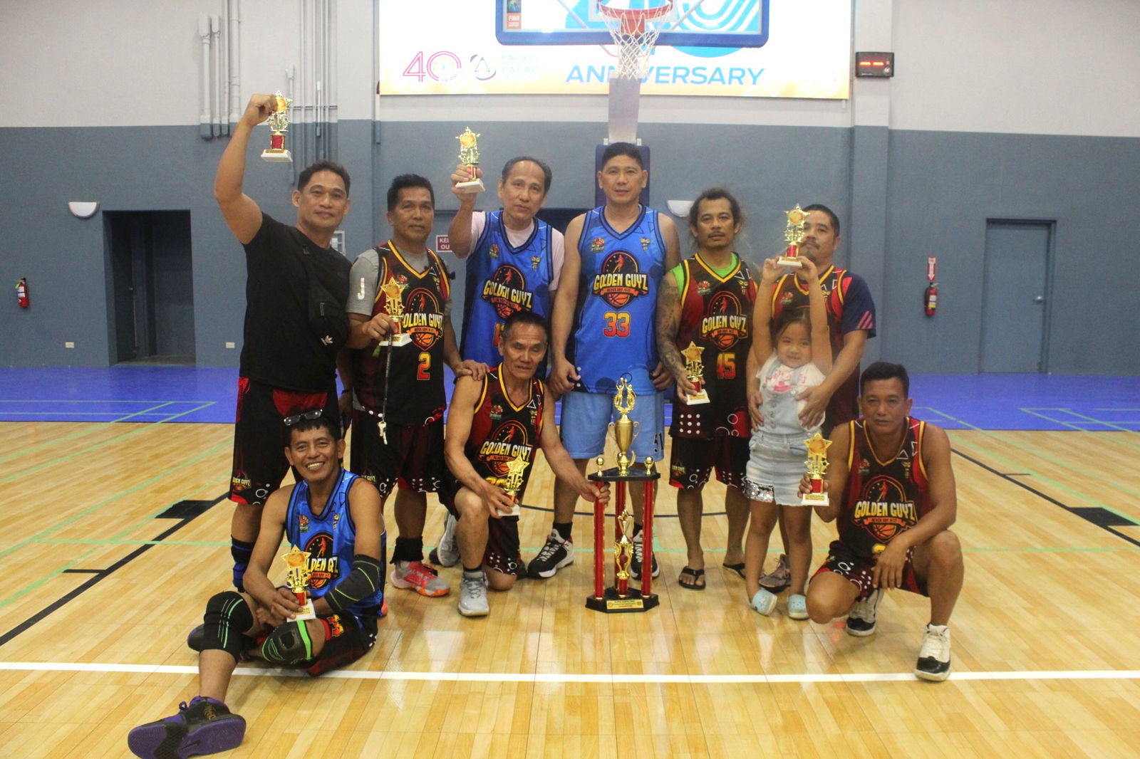 Golden Guyz North and South team members pose for a group photo after the conclusion of the Alpha Kappa Rho 1st Semi-Open Invitational Basketball League masters division championship at the Gilbert C. Ada Gymnasium on Sunday.Contributed photo