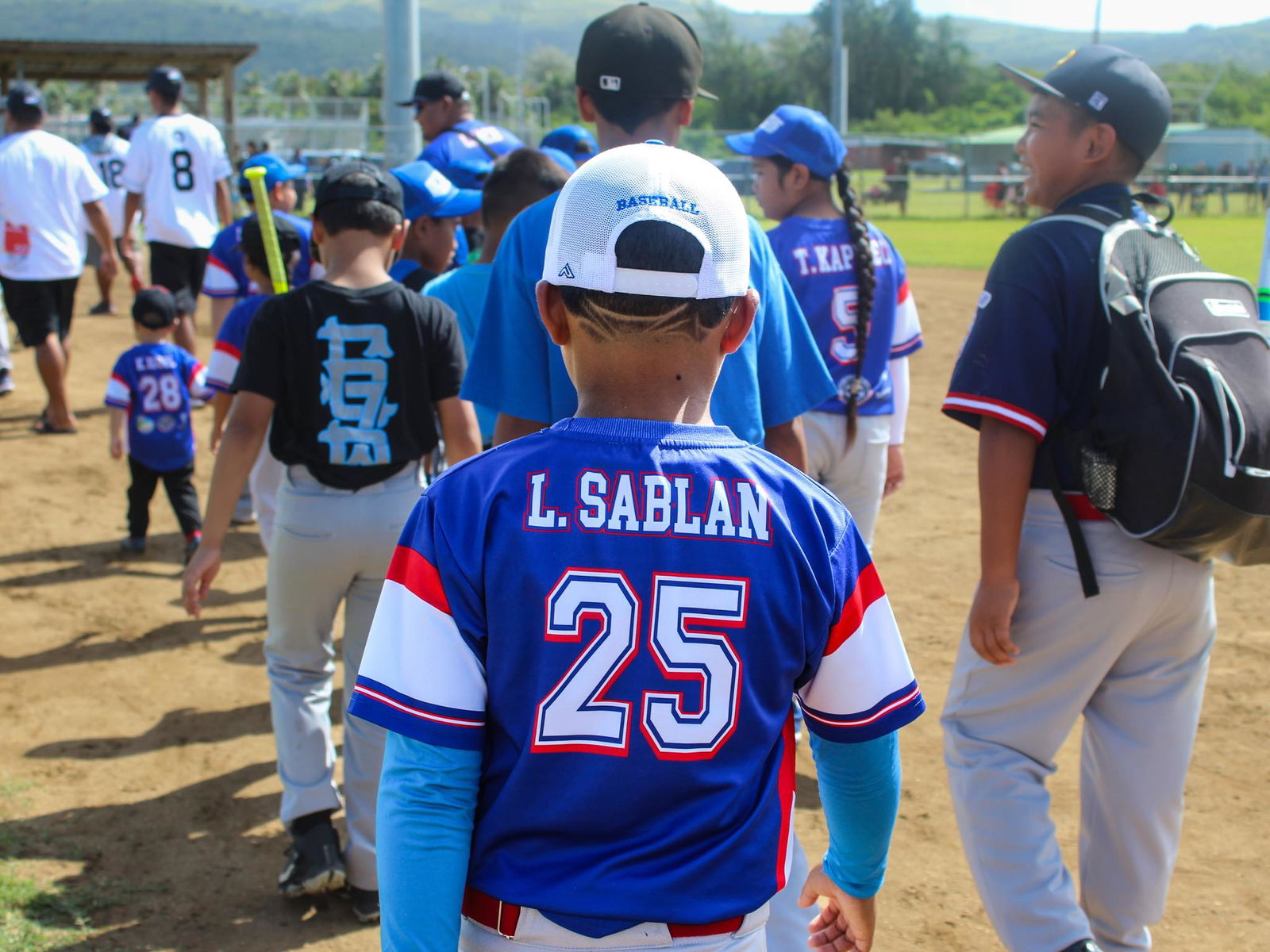 Ol' Aces' major division players enter the Miguel Tange Basa Pangelinan Ballfield for their first game on March 22, 2025.Ol' Aces Baseball Media photo