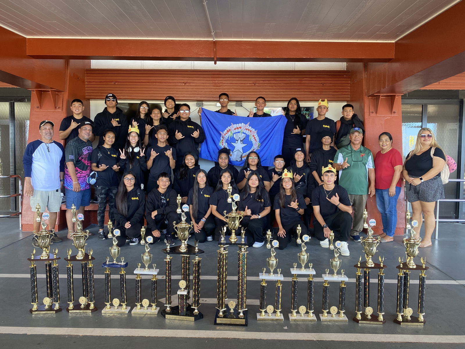 The Saipan Southern High School Manta Ray Battalion cadets pose with their trophies for a group photo at the Francisco C. Ada/Saipan International Airport on Tuesday, April 29, after returning in triumph from the Golden Bear West Coast National Drill Meet in California.