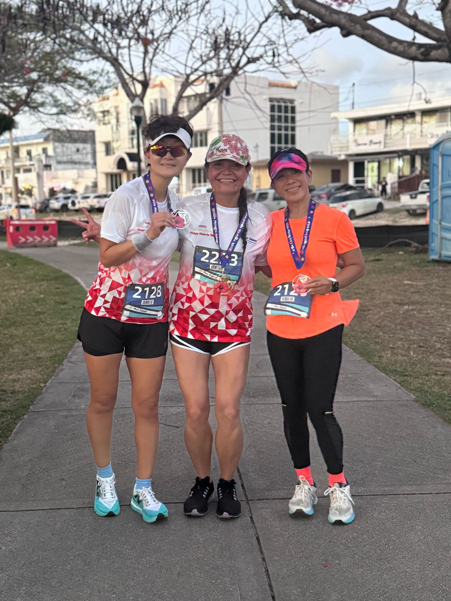 U.S. Congresswoman Kimberlyn King-Hinds, center, An Bang and Rosemarie Chisato are the top three finishers in the women’s division of the Run Saipan x CHCC Happy Hearts 5K on the Beach Road pathway on Friday.Contributed photo