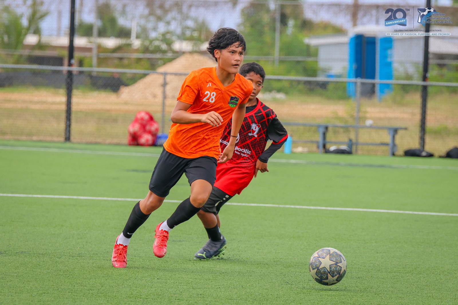 Kanoa Football Club 1's Damien Concepcion pushes the ball forward after evading a defender during a U14 boys division game of the TakeCare Youth Soccer League Spring 2025 at the NMI Soccer Training Center in Koblerville.NMIFA photo