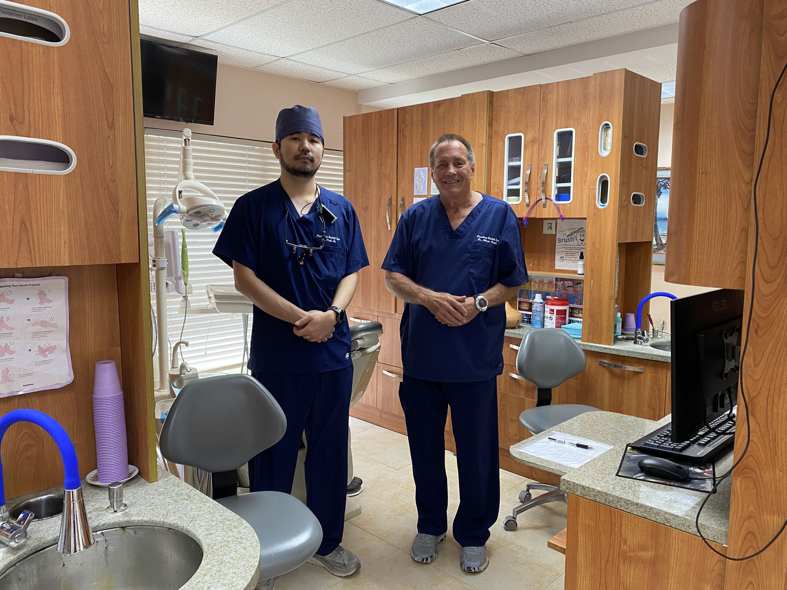 Dentists Paul Na, left, and Nelson Krum pose for a photo at Paradise Dental Spa.