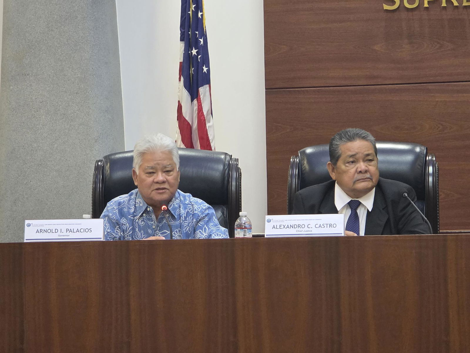 Gov. Arnold I. Palacios and CNMI Chief Justice Alexandro Castro in the CNMI Supreme Court courtroom on Thursday morning for the joint CNMI-Guam 2025 Law Week proclamation signing ceremony.Photo by Bryan Manabat