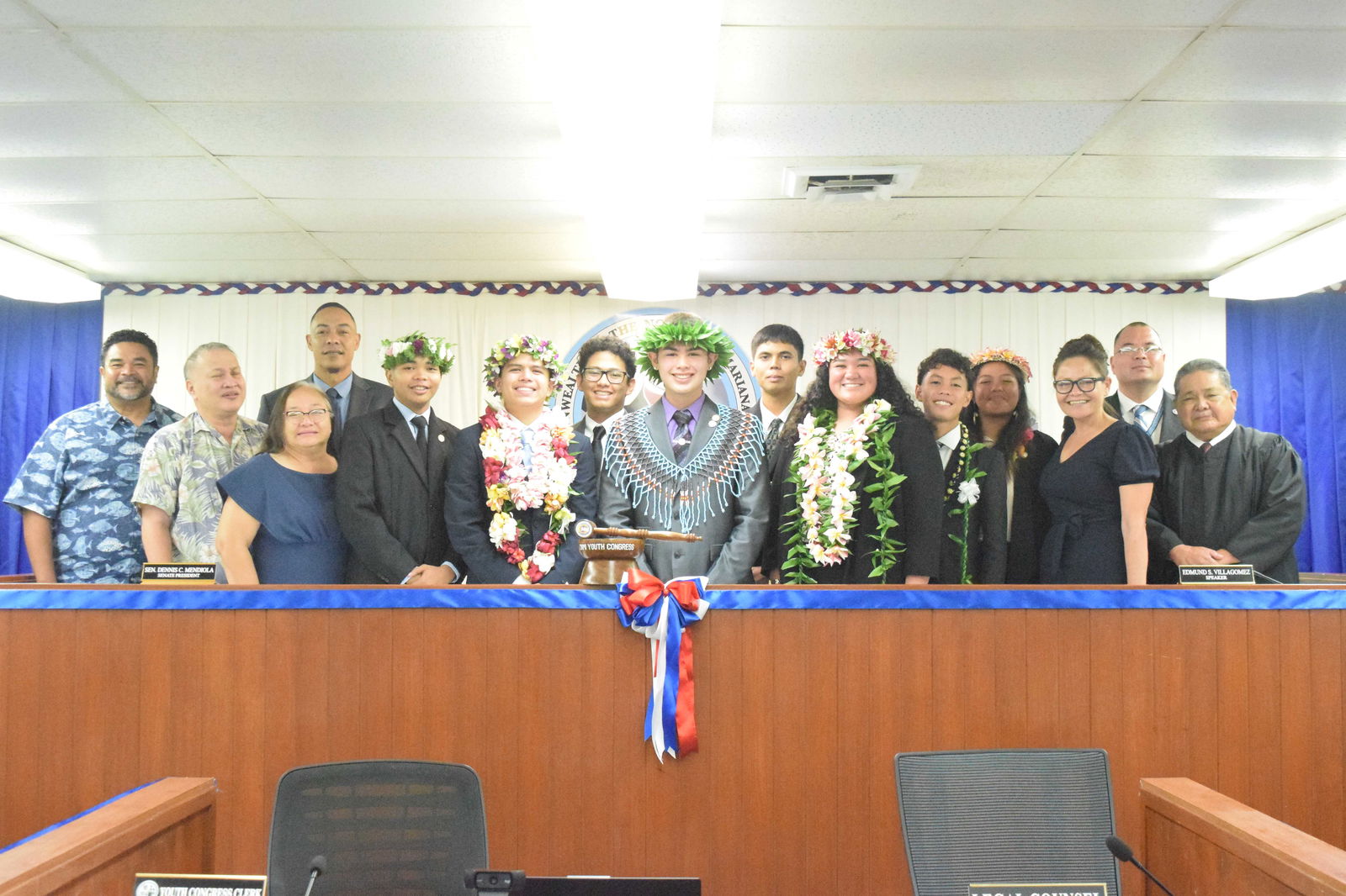 Members of the 20th Youth Congress pose for a photo with U.S. Congresswoman Kimberlyn King-Hinds, Speaker Edmund S. Villagomez, Senate President Dennis James Mendiola, Chief Justice Alexandro Castro, Board of Education Chairman Kodep Ogumoro-Uludong, BOE member Andrew Orsini, and Saipan and Northern Islands Municipal Councilwoman Carmen C. Pangelinan during the inaugural session on Saturday in the House chamber. Photo by Emmanuel T. Erediano
