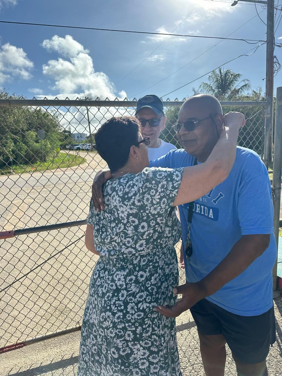 Steven Metayer, family friend, congratulates Ms. Mili and her husband Jaime.