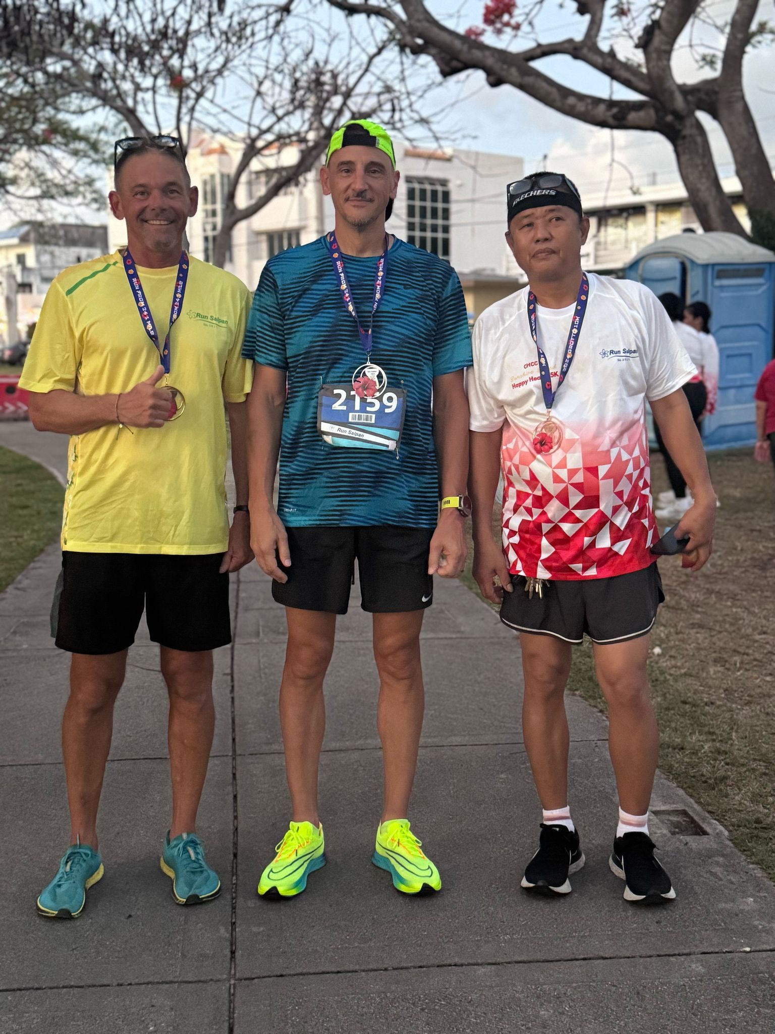 James Munnis, left, with Matthew Furan and Edmundo Bato — the top three finishers in the men’s division of the Run Saipan x CHCC Happy Hearts 5K on the Beach Road pathway on Friday.Contributed photo