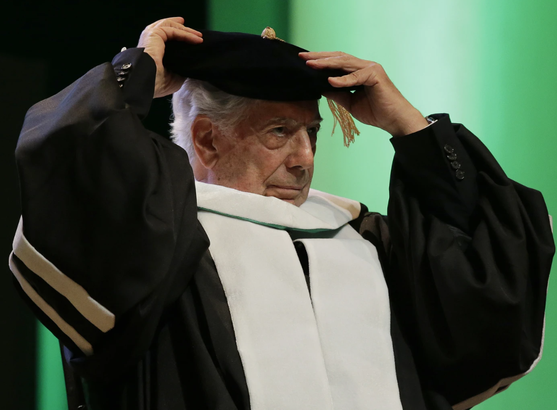 Peru's Nobel Literature Prize laureate Mario Vargas Llosa rearranges his hat during ceremonies for his conferment of the degree of Doctor of Literature, Honoris Causa, at the De La Salle University in Manila, the Philippines, Nov. 8, 2016.