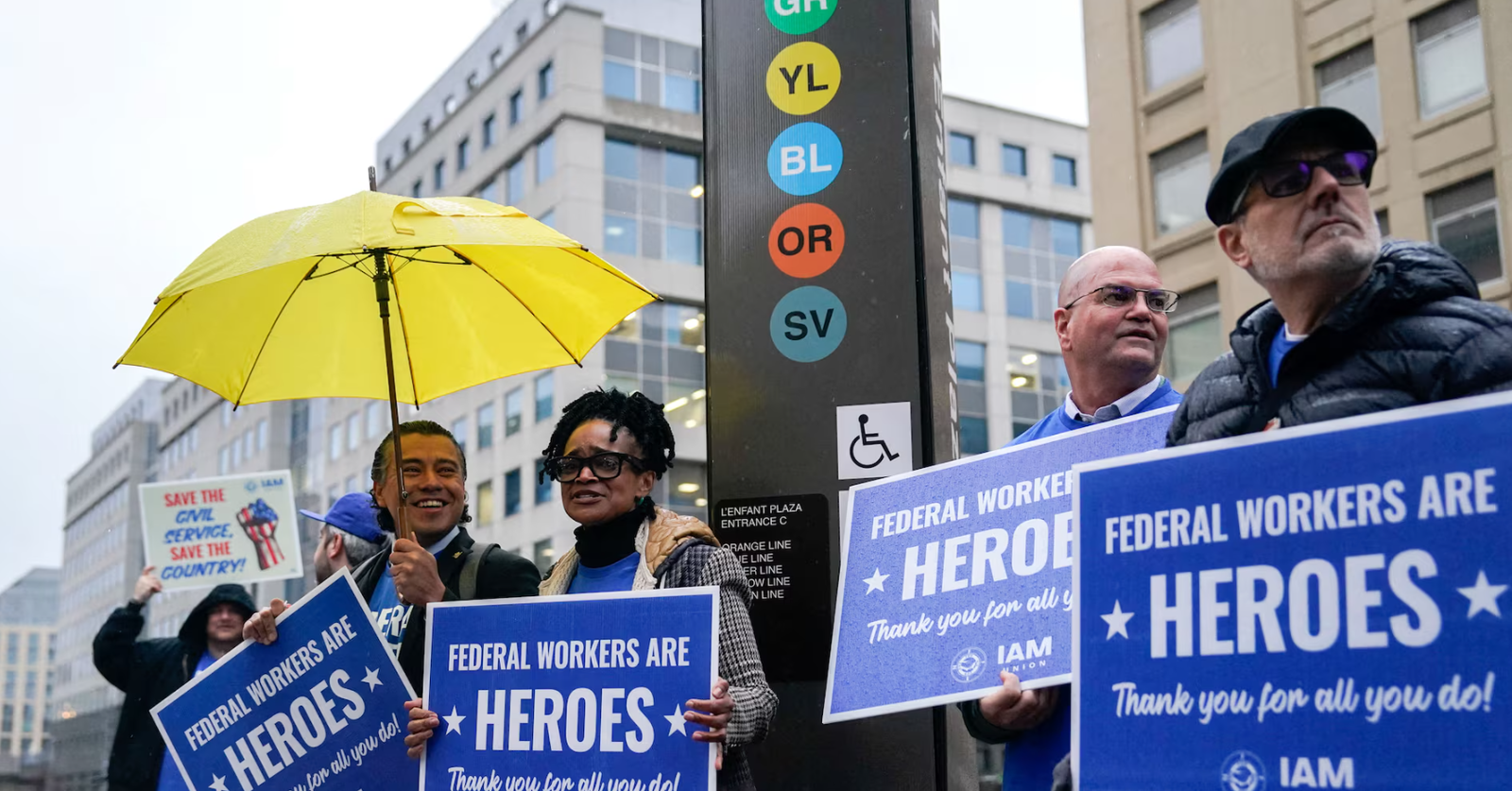 Labor union members hold placards on the day of a rally in support of federal workers during a rush hour protest outside the L'Enfant Plaza Metro Station in Washington, D.C., March 24, 2025.REUTERS