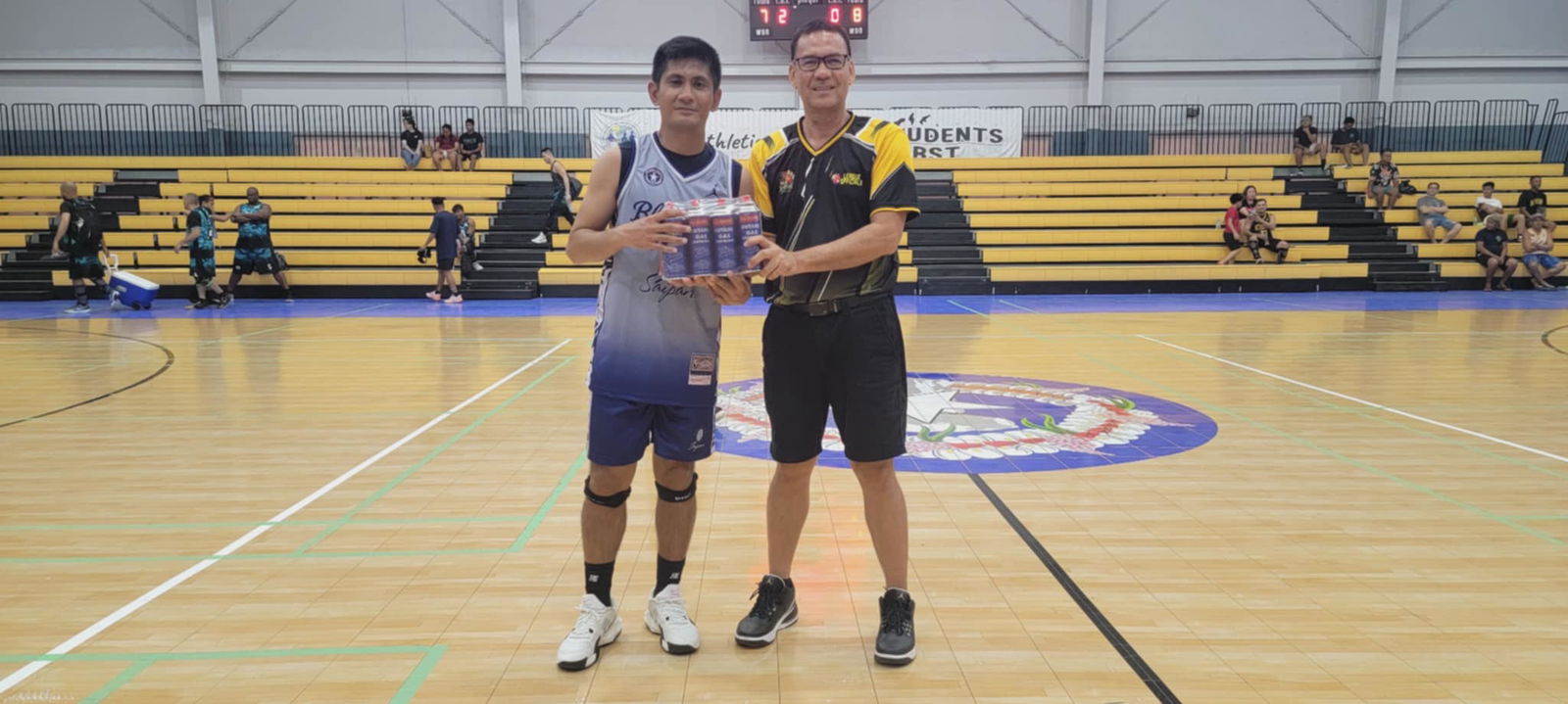 Blue Haus’ Ron Gamboa, the Best Player of the Game, poses with League Commissioner Bernie Ebuen after receiving a case of butane gas sponsored by Best Deal on Sunday at the Ada Gym.Contributed photo