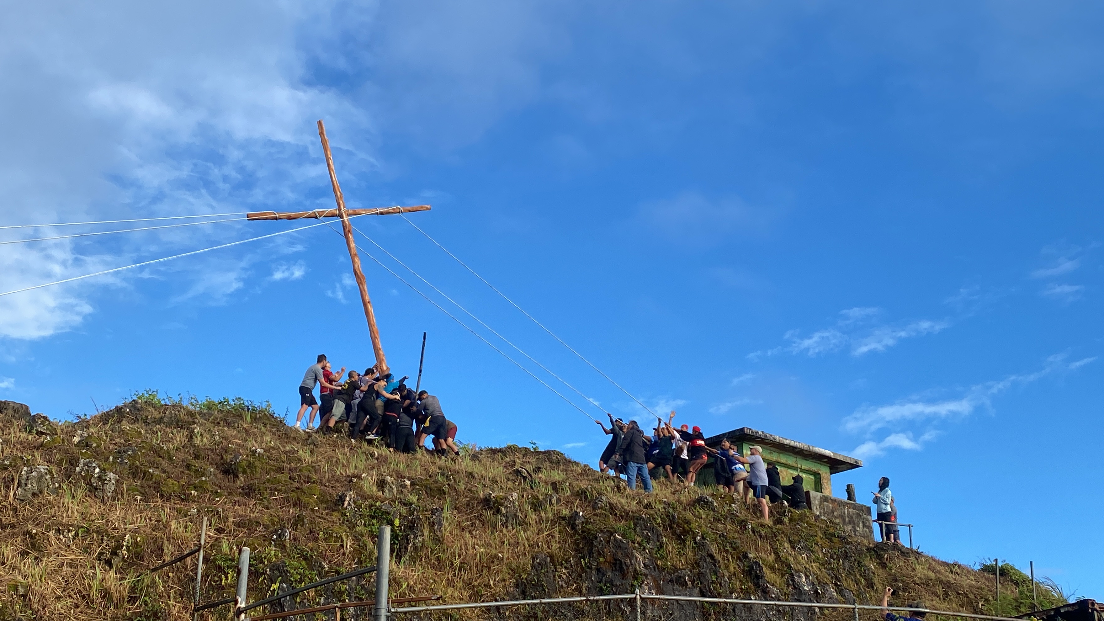 On Good Friday, a wooden cross was raised atop the island’s highest summit.