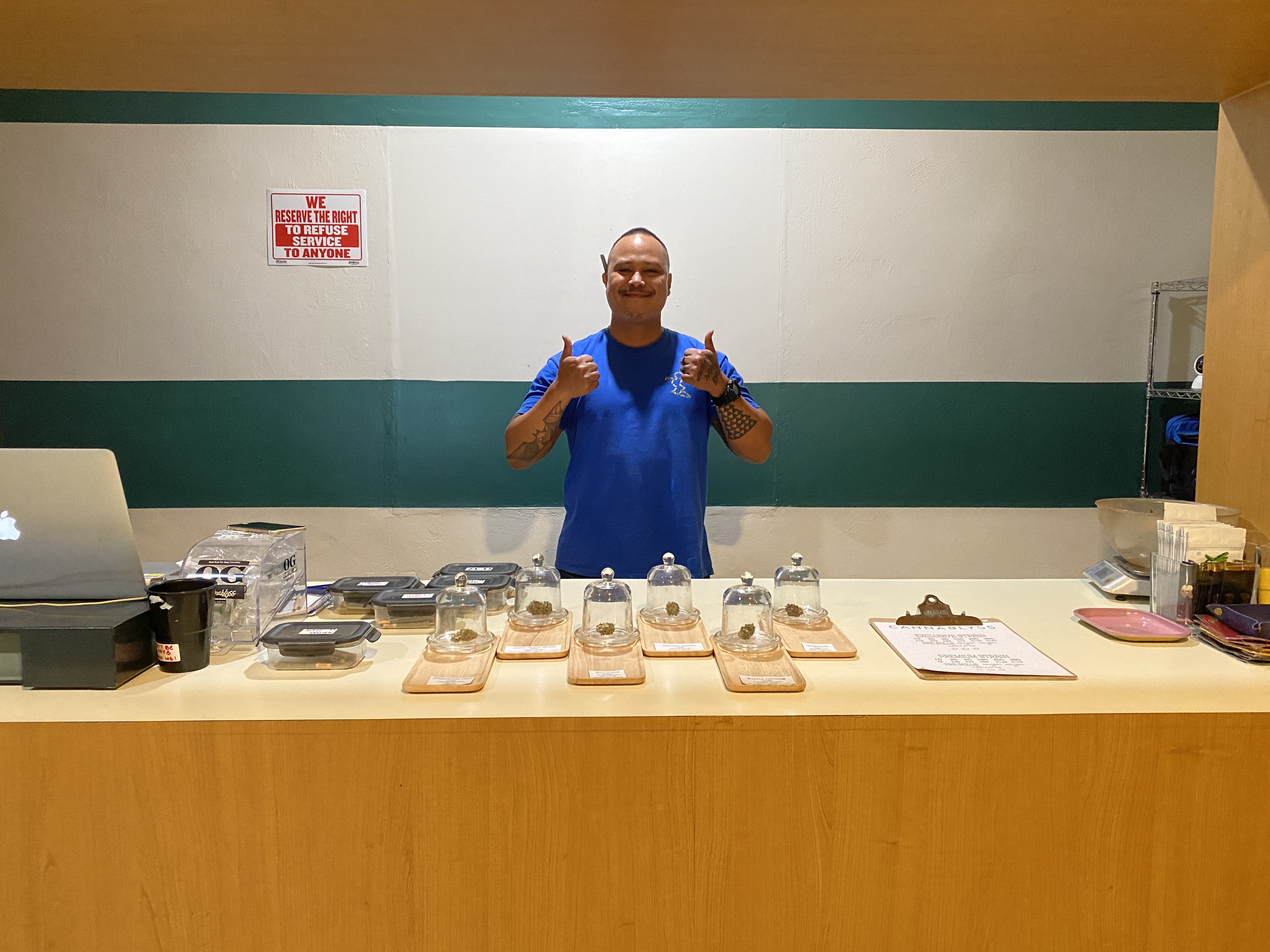 Eric Grim handles the buds and helps customers at CannaBlyss.