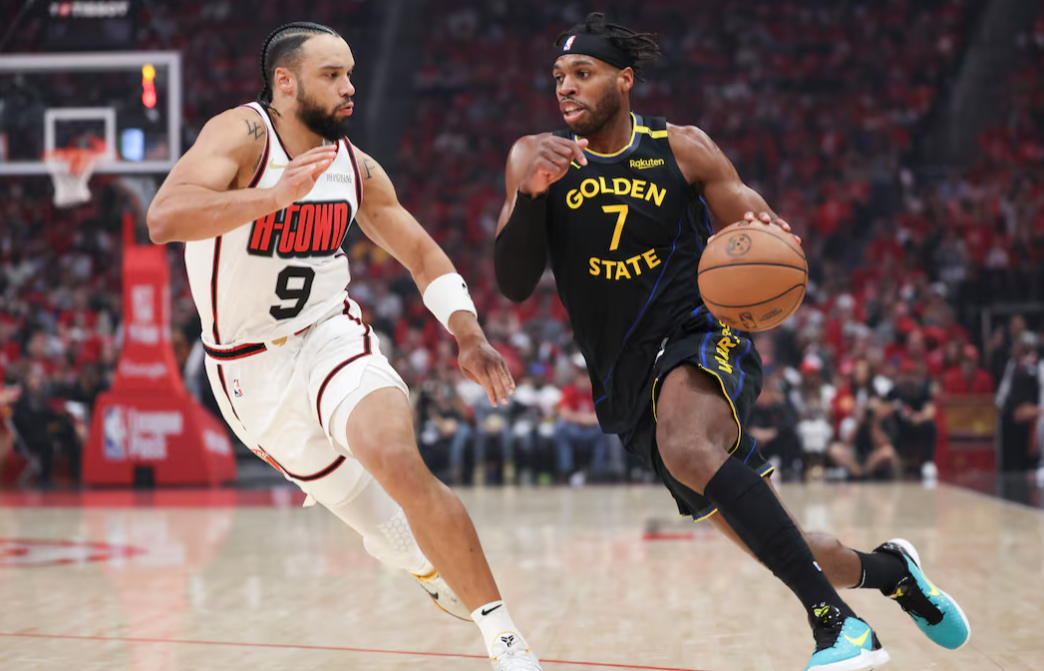 Golden State Warriors guard Buddy Hield (7) dribbles the ball as Houston Rockets forward Dillon Brooks (9) defends during the first quarter of game seven of the first round for the 2025 NBA Playoffs at Toyota Center in Houston, Texas, May 4, 2025.Photo by Troy Taormina/Imagn Images