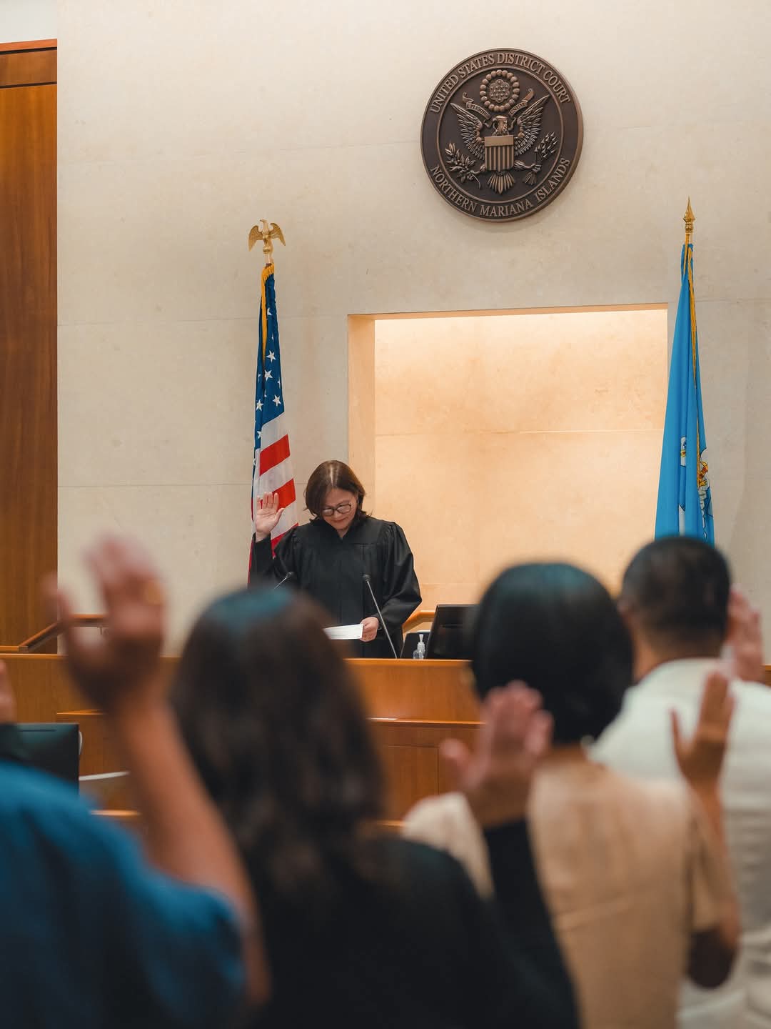 Chief Judge Ramona V. Manglona of the District Court for the NMI swears in the new U.S. citizens.