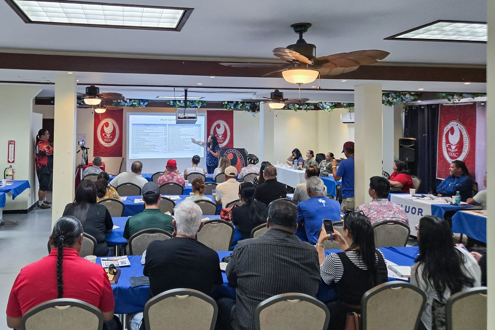 Ailie Souriolle, director of small business programs for Pacific Air Forces, presents to the Tinian Industry Day attendees.