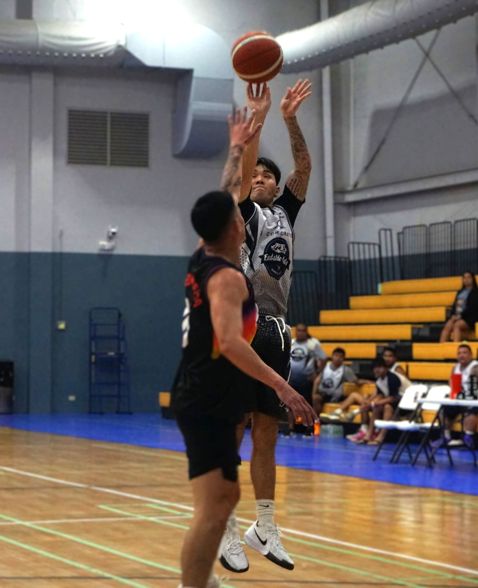 Eastside Cuts’ Tony Kim pulls up for a contested jump shot during a Michelob Ultra Cup game at the Ada gym.Photo by James F. Sablan Jr.