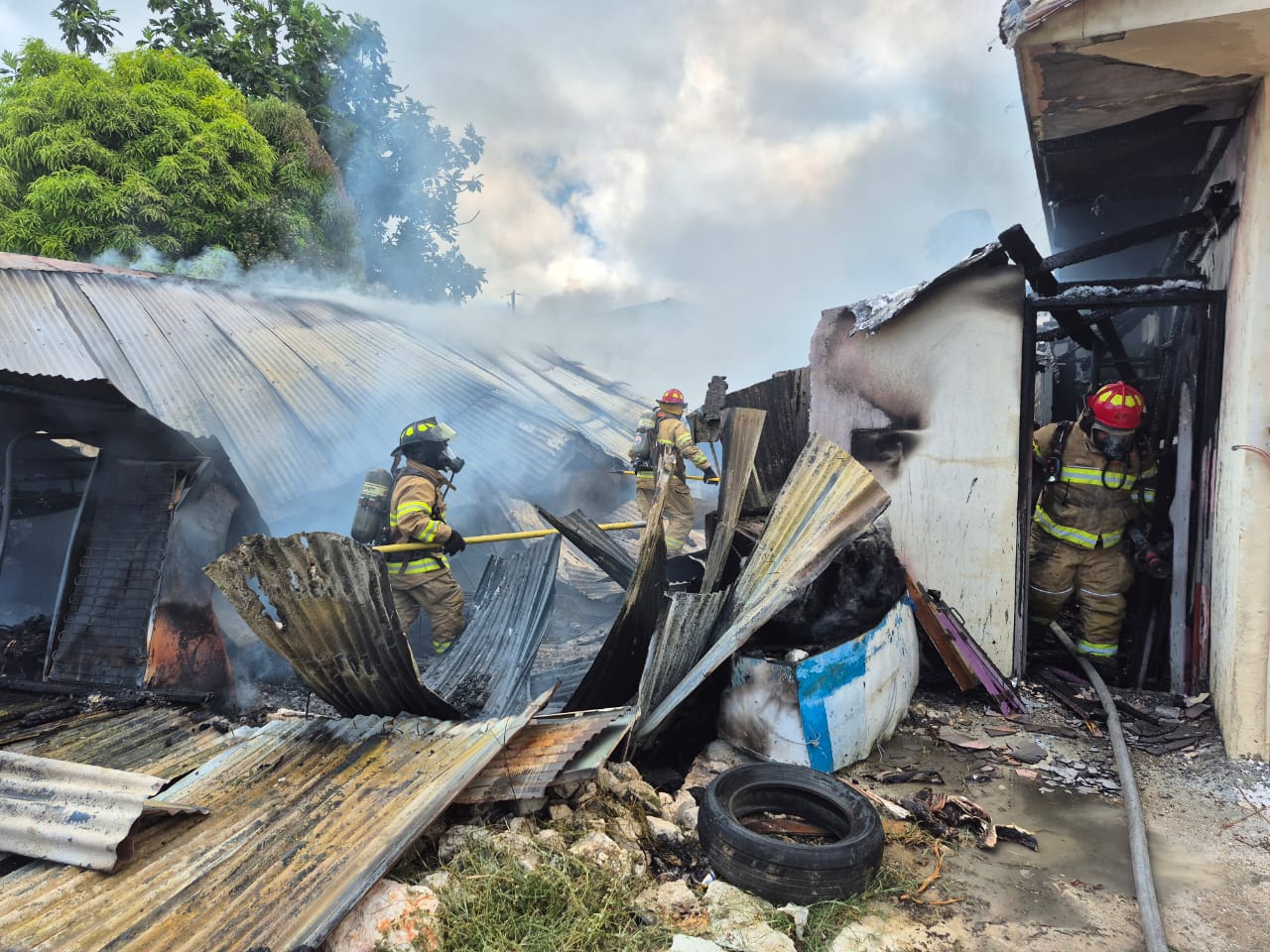 Firefighters conduct a “mop-up” operation to ensure that the blaze has been fully extinguished.