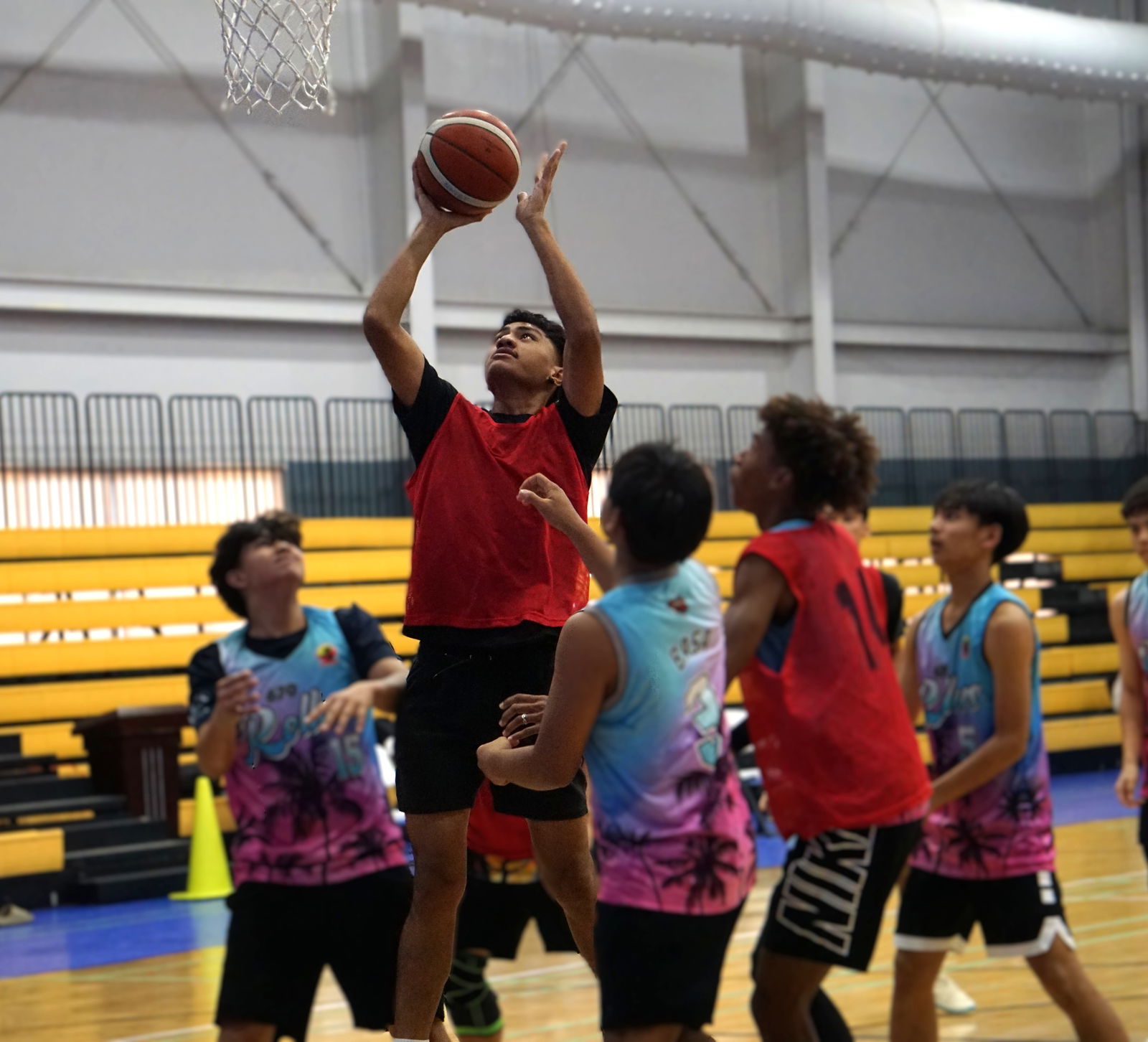 TurnKey Solution G-Rollers’ Bruce Tasi goes up for the put-back during a game against Kada Dia G-Rollers in the U18 boys division of the 2025 Allied Pacific Environmental Consulting Basketball League at the Ada gym last Saturday.Photo by James F. Sablan Jr.