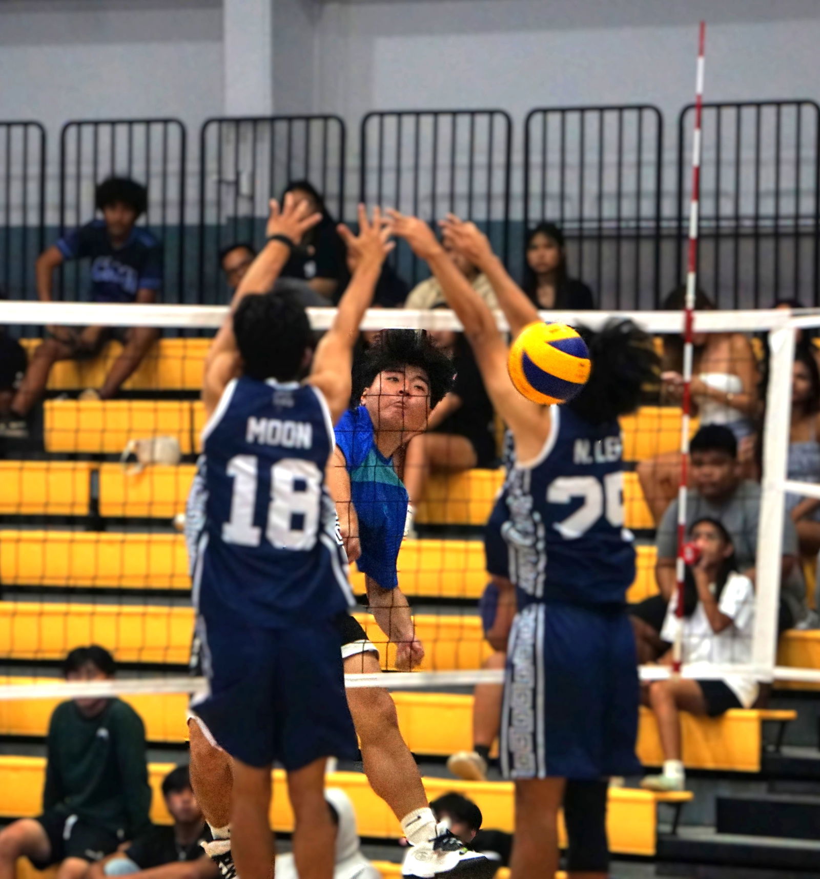 SIS’ Sui Yi spikes the ball past MHS defenders during the boys high school championship game of the PSS-NMIVA Interscholastic Volleyball League SY24–25 at the Ada gym on Saturday.Photo by James F. Sablan Jr.