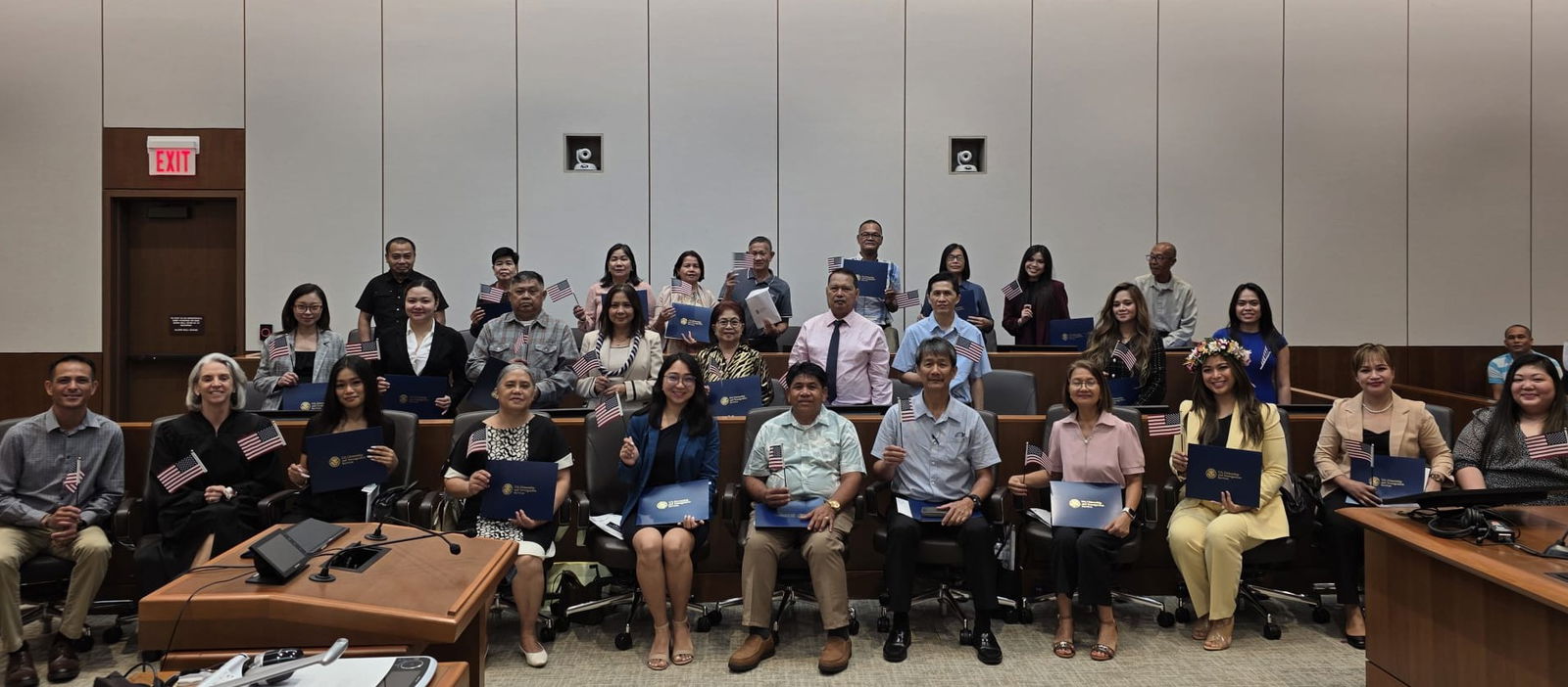 Twenty-six new U.S. citizens were sworn in during a naturalization ceremony at the District Court for the NMI on May 19, 2025. Also in the photo are Magistrate Judge Heather Kennedy; the guest speaker, U.S. Army 9th Mission Support Command, Family Readiness Support Assistant James Kennedy Weilbacher DLG Benjamin; and USCIS Officer Thea Juaneza.Photo By Bryan Manabat