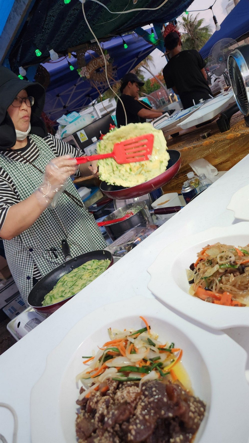 Loco & Taco serves up Korean dishes as one of 26 food and drink vendors at the 26th Annual Taste of the Marianas International Food Festival on May 10, 2025, at American Memorial Park, Saipan. The festival continues on Saturday evenings throughout May.