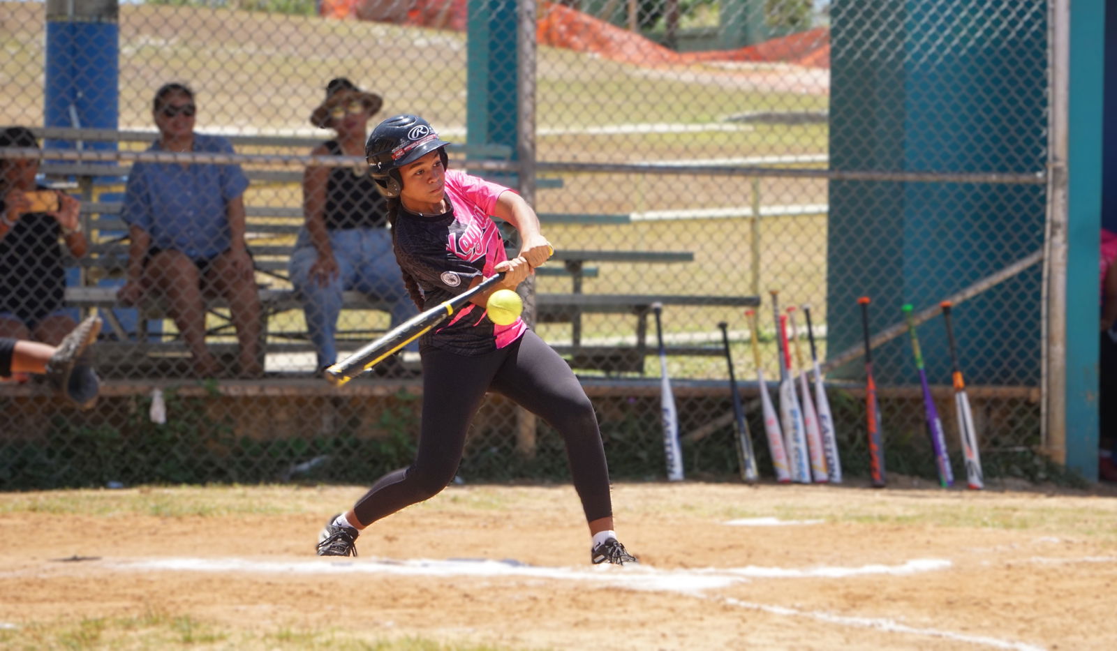 Kagman High School’s Marlaina Benjamin connects a single during the championship game against Marianas High School in the girls high school division of the PSS-NMISA Interscholastic Fastpitch Softball League SY24-25 at the Capital Hill ball field on Saturday.Photo by James F. Sablan Jr.