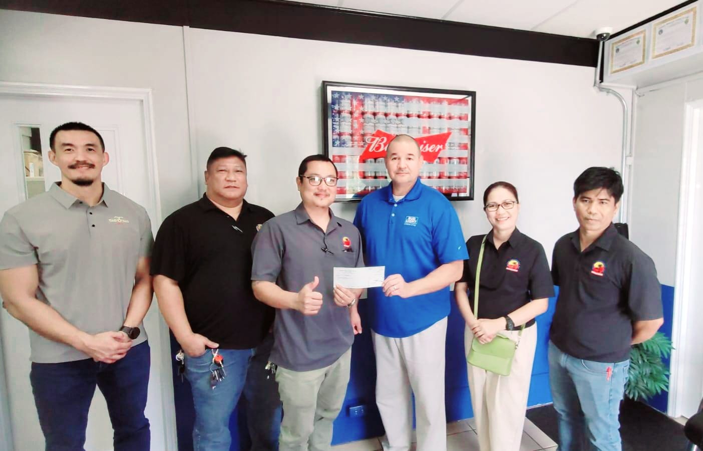 James Lee, Marpac beverage sales manager, Raymond David, amusement manager, Cecile Vivero, Ivan Sales, SEDA & SBA League secretary, Guy Pudney, Marpac resident manager, Cecile Vivero, Pacific Amusement controller, and Warlee Ellama, Pacific Amusement senior tech, pose with Marpac’s donation.Contributed photo