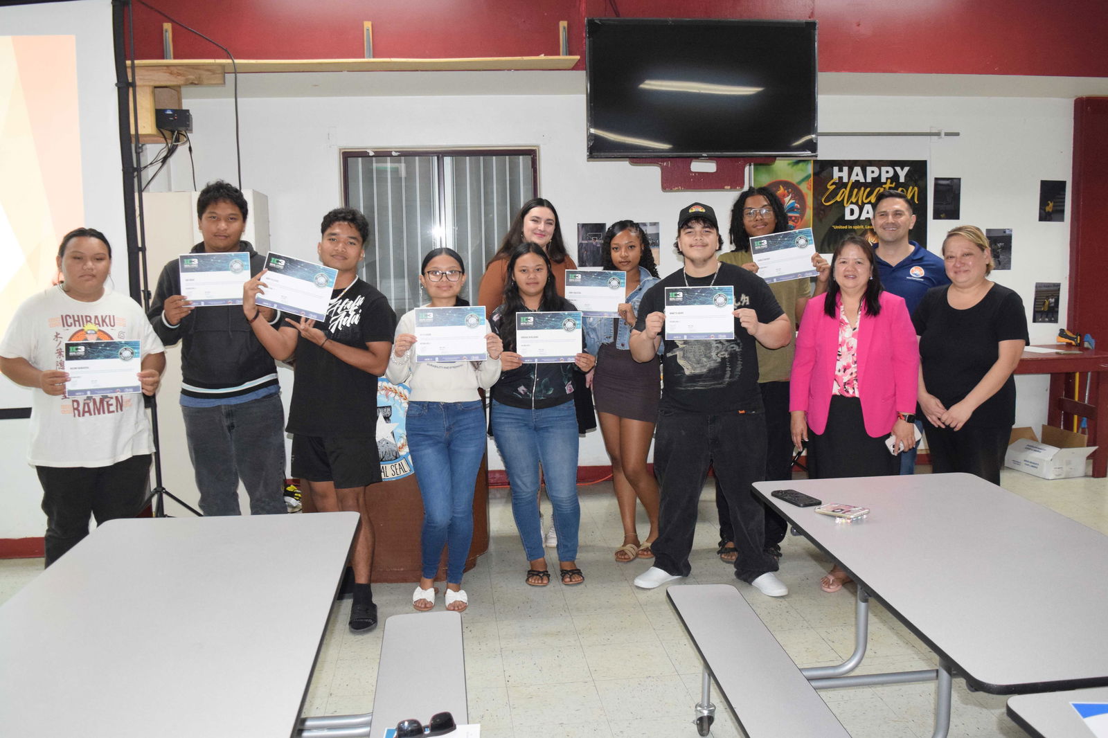 The Kagman High School students who completed the IC3 Digital Literacy certification course pose for a photo with Public School System Senior Director for Curriculum and Instructional Services Dr. Rizalina Liwag, PSS Technical Education Program Director Dr. Jessica B. Taylor, Island Training Solutions Chief Operating Officer Alex Hu, and ITS instructor Shea Hartig in the KHS cafeteria on Friday.