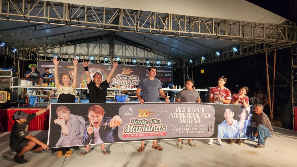 Sachiko Masubuchi and Max Suzuki of Japan, standing left, celebrate their victory in the Inas’ Kitchen International Food Challenge on May 10, 2025, at the 26th Annual Taste of the Marianas International Food Festival at American Memorial Park, Saipan.