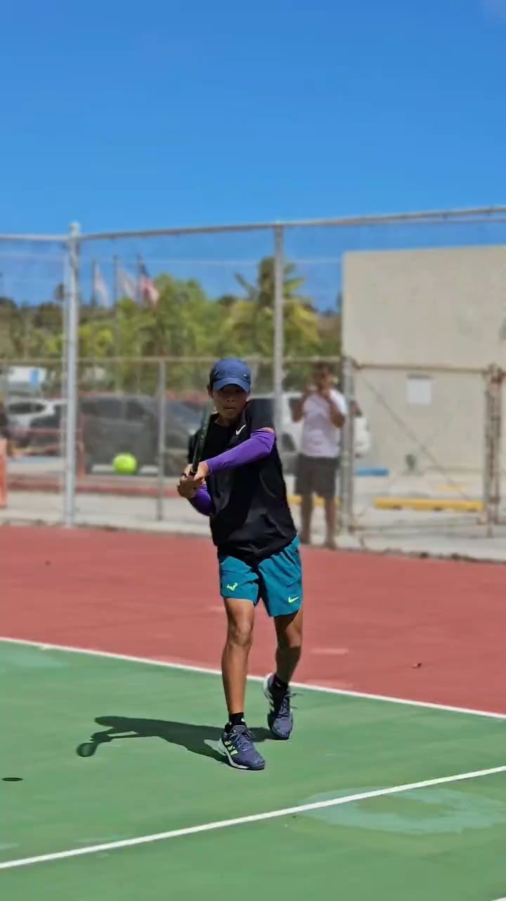 Kyle Landicho connects a backhand return during a Doubles Mixed Open finals match of the Pacific Islands Club Saipan 2025 Tennis Championships held over the weekend at the PIC tennis courts.