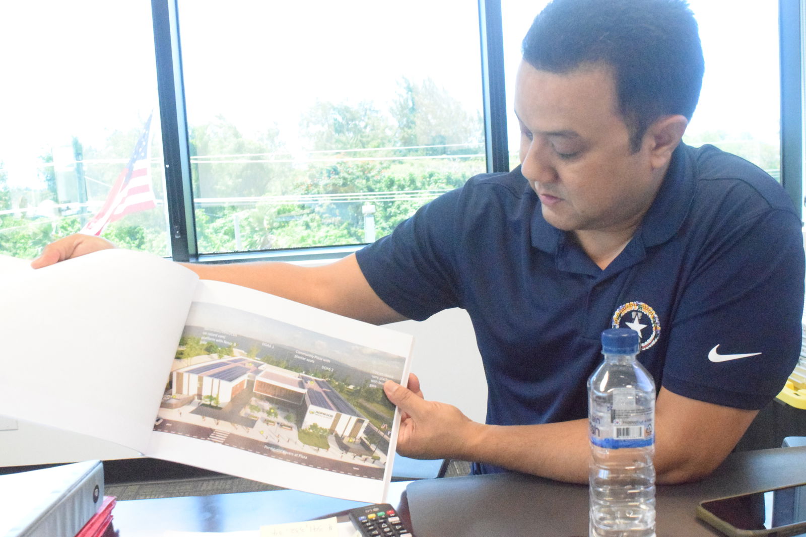 Public Assistance Officer Patrick Guerrero shows an architectural and engineering design of one of the disaster recovery projects funded by the Federal Emergency Management Agency during an interview on Thursday.Photo by Emmanuel T. Erediano