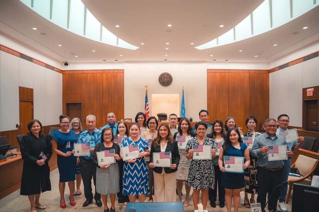 The new U.S. citizens pose for a photo with Chief Judge Ramona V. Manglona of the District Court for the NMI, U.S. Congresswoman Kimberlyn King-Hinds, and USCIS Officer Patricia Phelan.