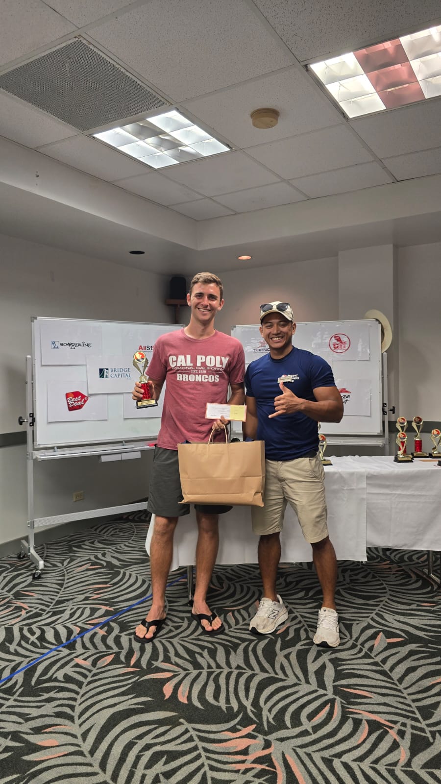 Colin Ramsey, the Singles Men's Open champion, poses with PIC Saipan Sports, Entertainment and Activities manager Reymark Castro, during the awards ceremony of the Pacific Islands Club Saipan 2025 Tennis Championships at PIC.