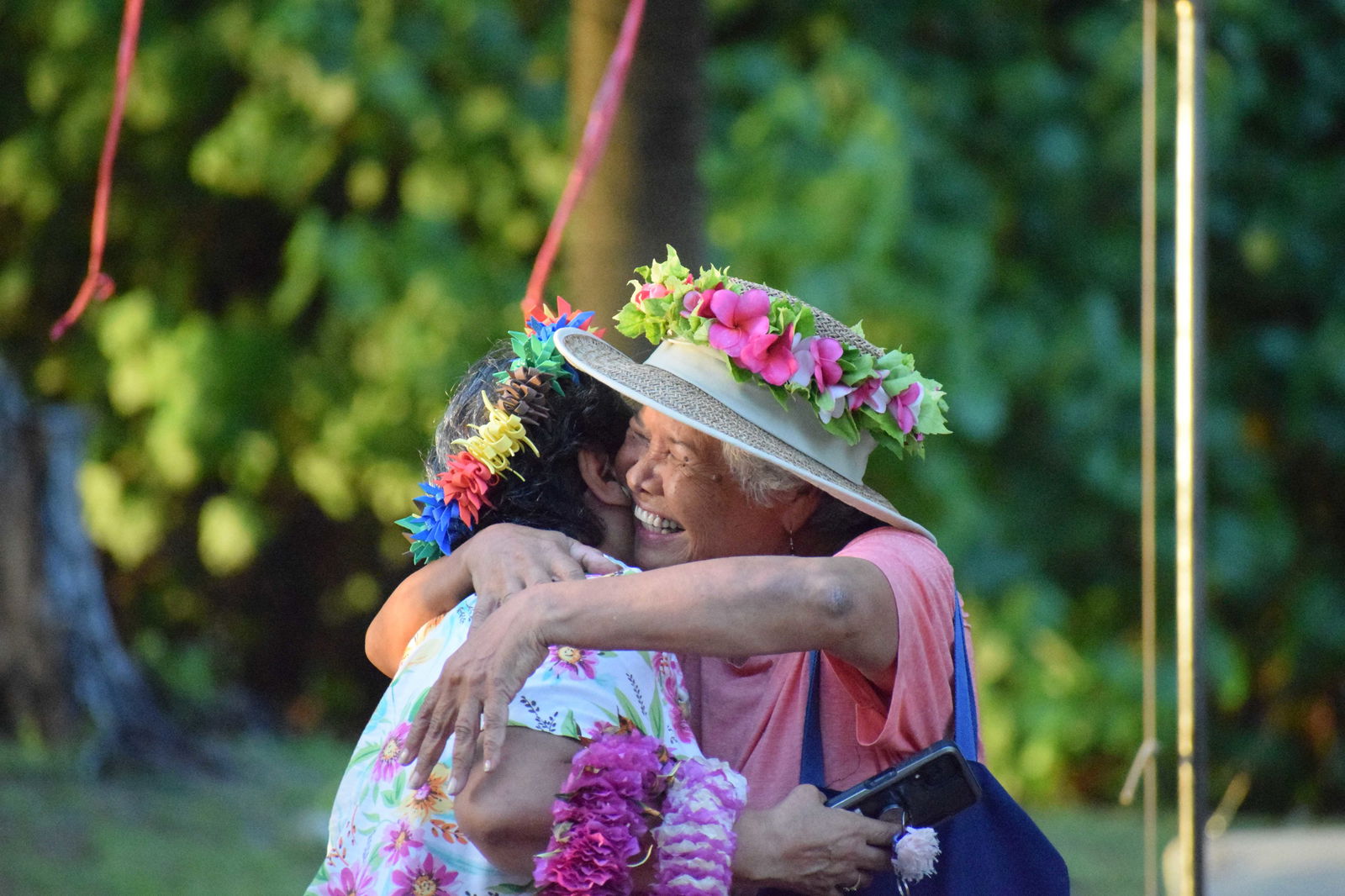 Emi Peter-Palican hugs Del Igitol, a member of the reunions organizing committee.