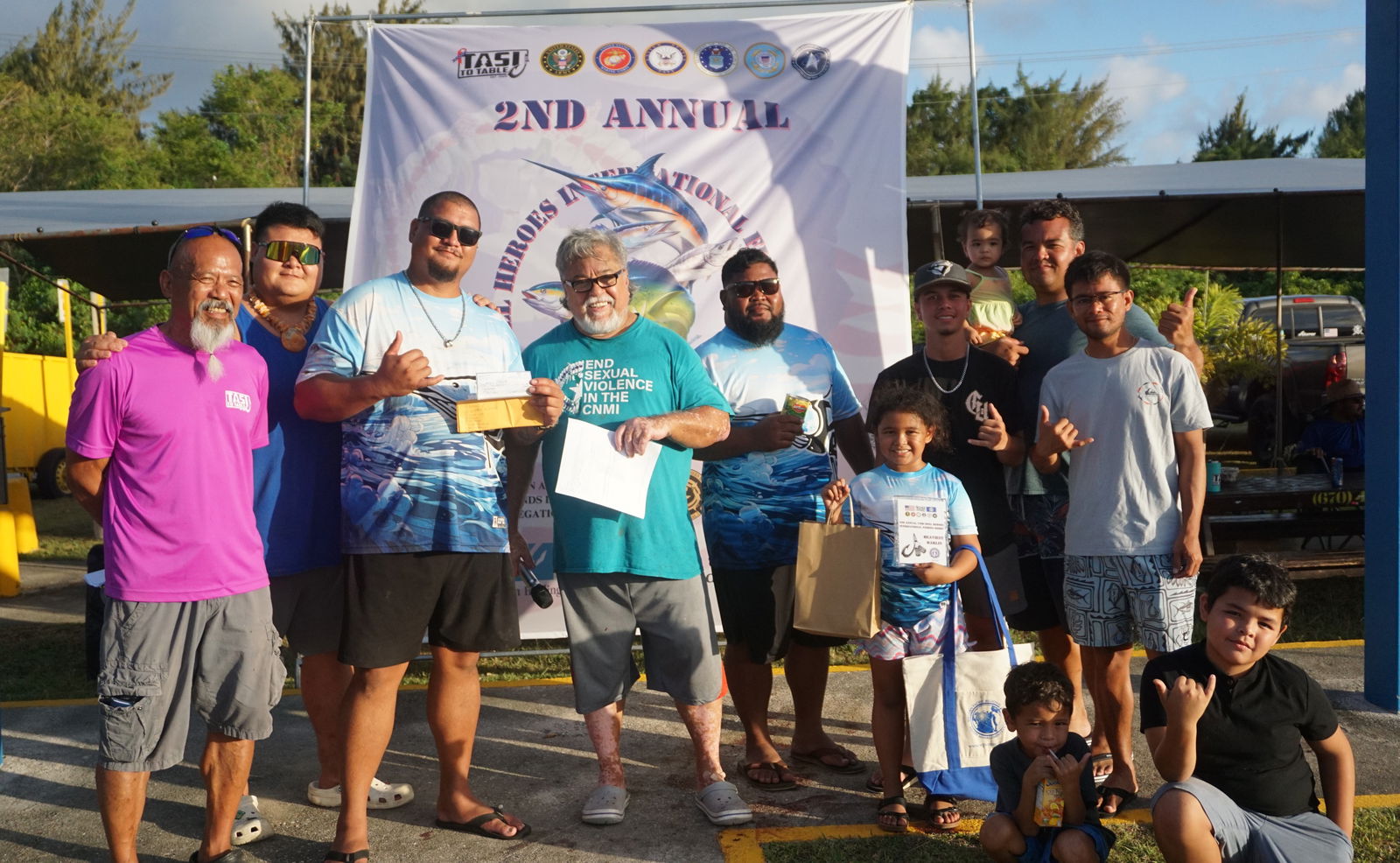 Captain James Roberto and the crew of Saba Too pose with the Heaviest Marlin plaque and a $2,000 check during the awards ceremony of the Tasi To Table CNMI Reel Hero's International Fishing Derby at the Smiling Cove Marina on Saturday.Photo by James F. Sablan Jr.