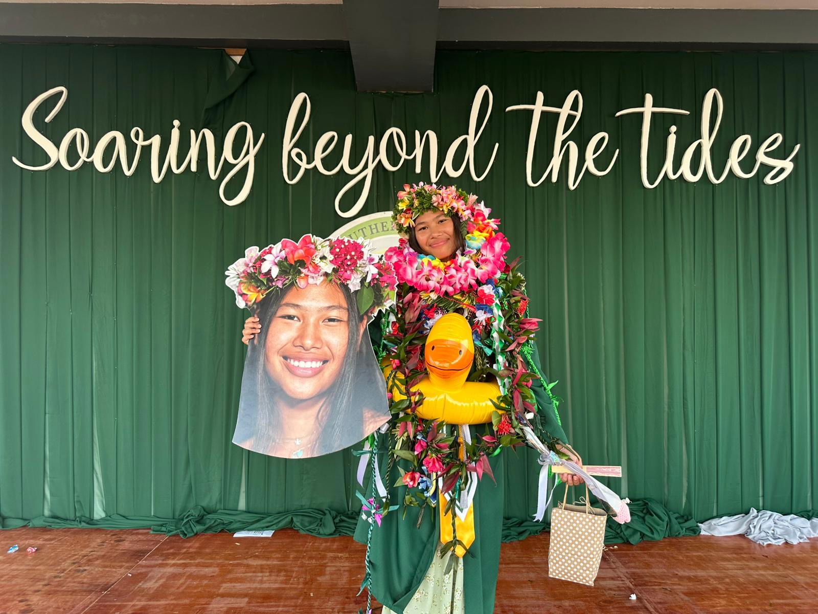 Top 9 graduate Mai Janae Sakai Peters smiles for the camera. Congratulations from her family!