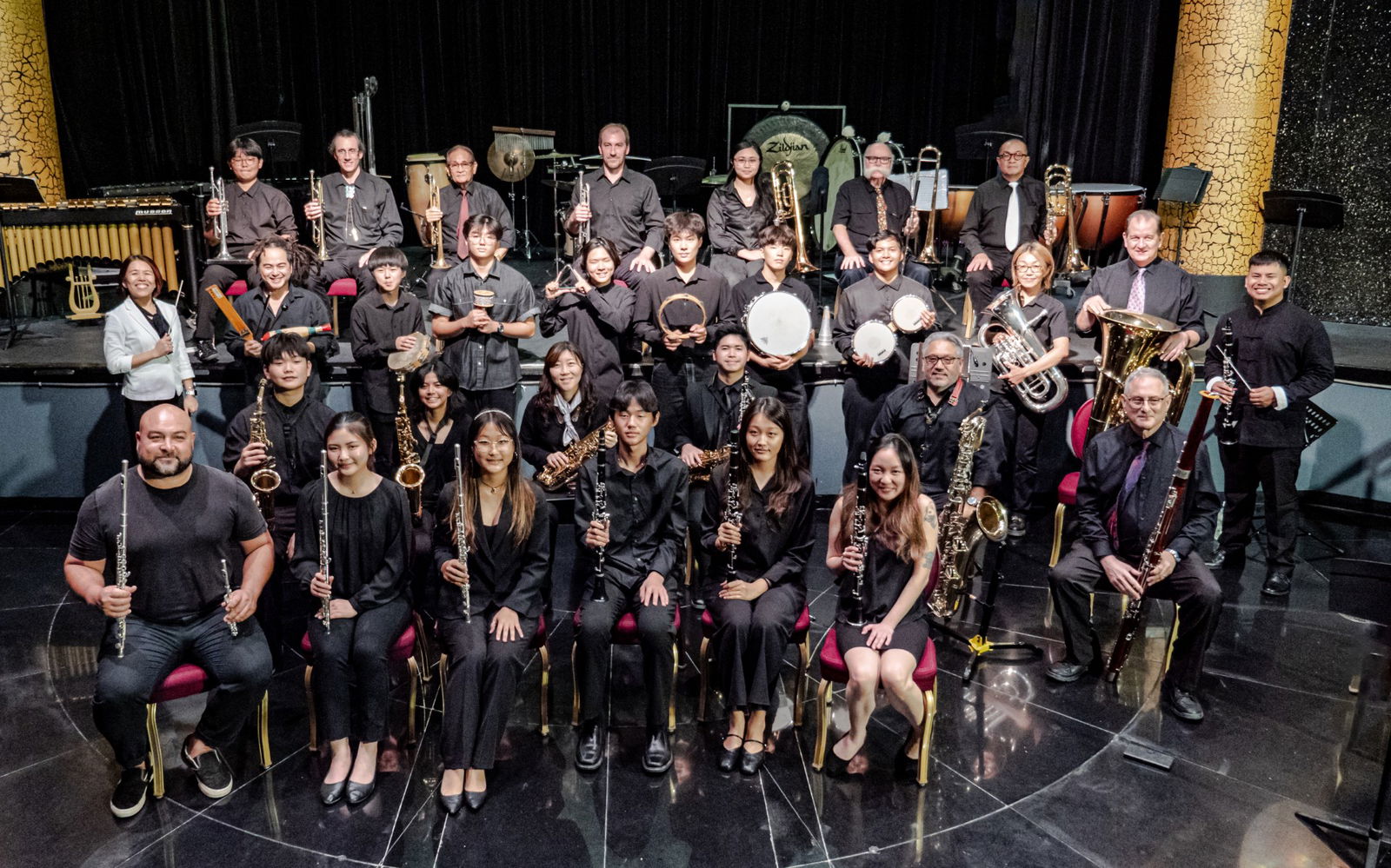 The Saipan Pacific Winds Concert Band and its director, Atsuko Eck, in white jacket, far left.
