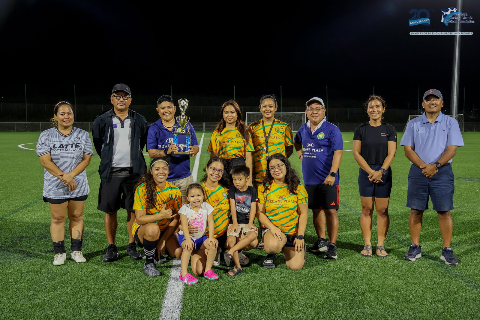 Matansa Football Club 2 players pose with the second-place trophy.NMIFA photo