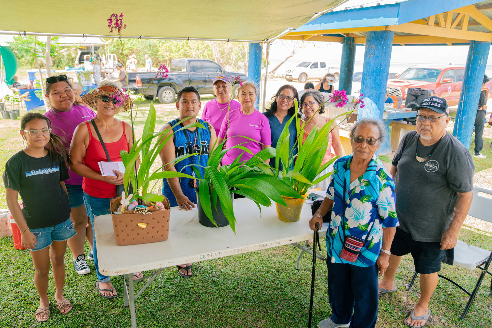 Winners from both categories gather for a group photo to celebrate their winning orchids. Also pictured is JM Guerrero, right, of JM & Associates.