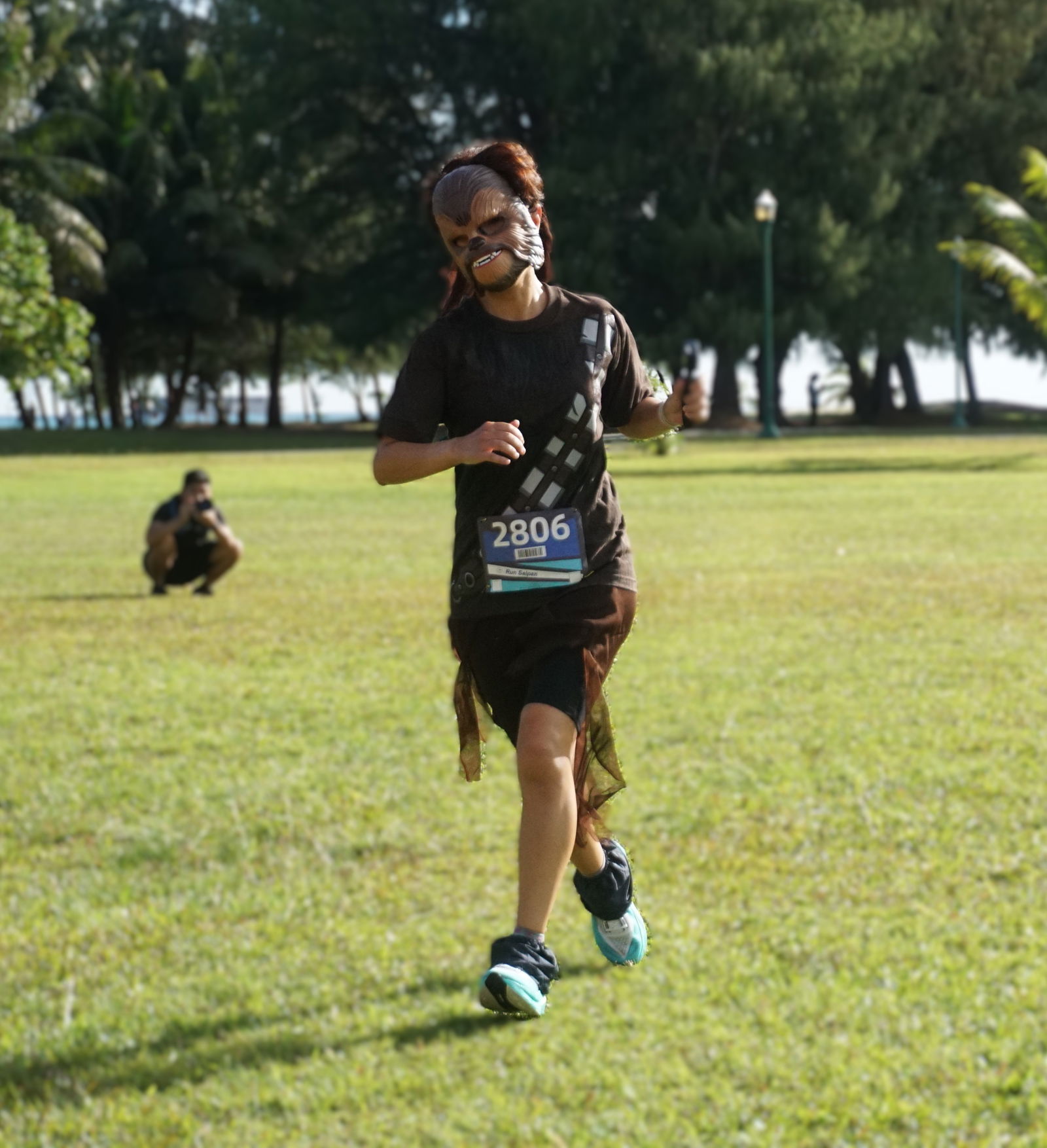 An Bang, wearing a Chewbacca mask, makes her way toward the finish line to claim first place in the female division of Run Saipan NMI Star Wars Day Run 2025 “May The 4th Be With You” event at American Memorial Park on Sunday.Photo by James F. Sablan Jr.
