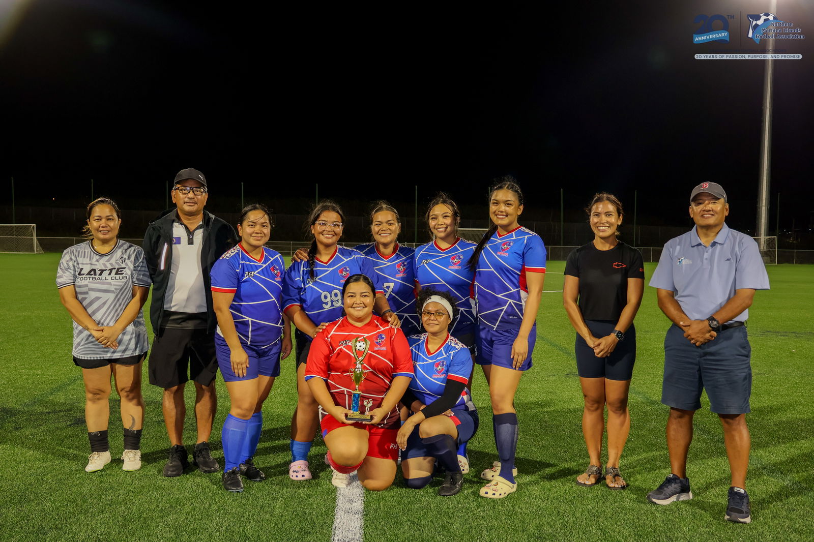 Shirley's Football Club 2 players pose with the third-place trophy.NMIFA photo