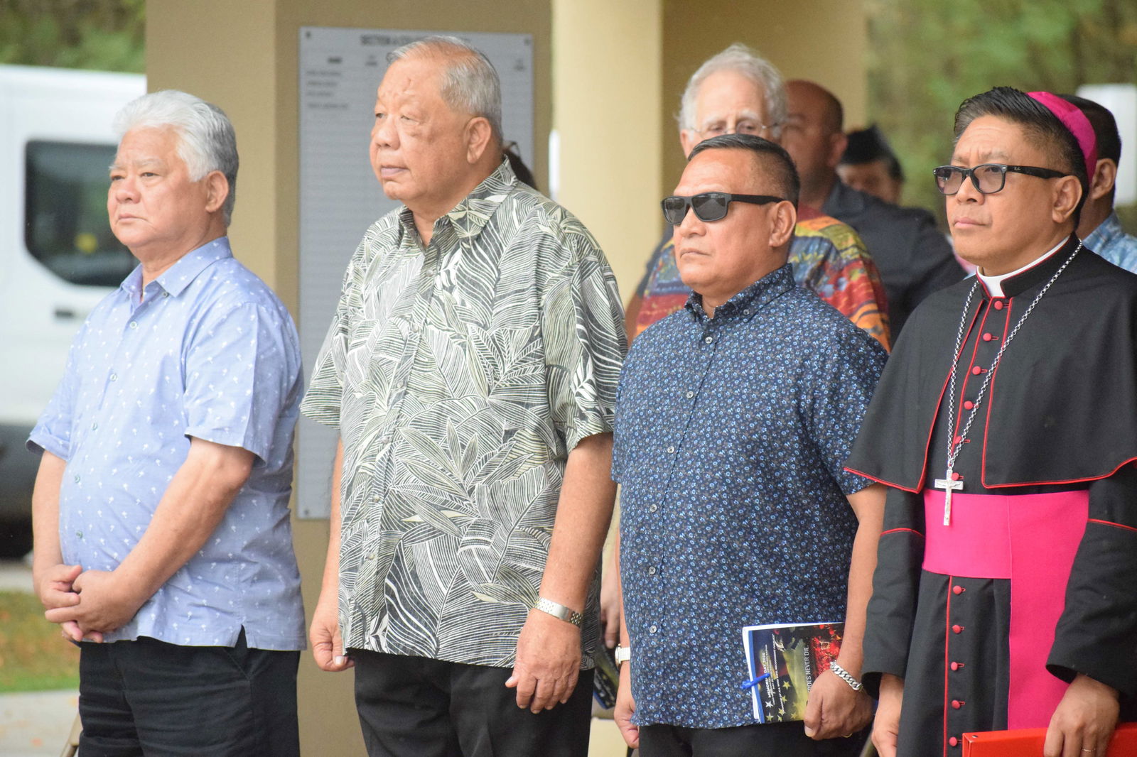 From left, Gov. Arnold I. Palacios, Lt. Gov. David M. Apatang, Special Assistant for Military Affairs Edward C. Camacho and Bishop Romeo D. Convocar stand at attention during the posting of colors.