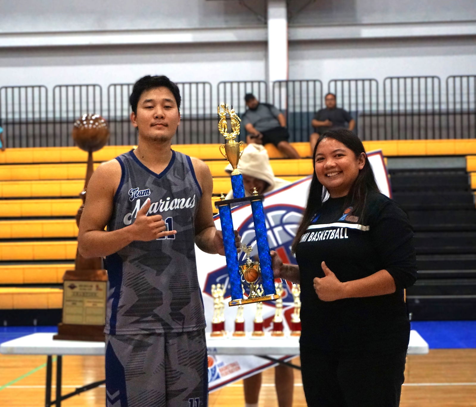 Finals MVP Coby Santos poses for a photo with NMI Basketball Federation board member Marlene Lumabi.Photo by James F. Sablan Jr.