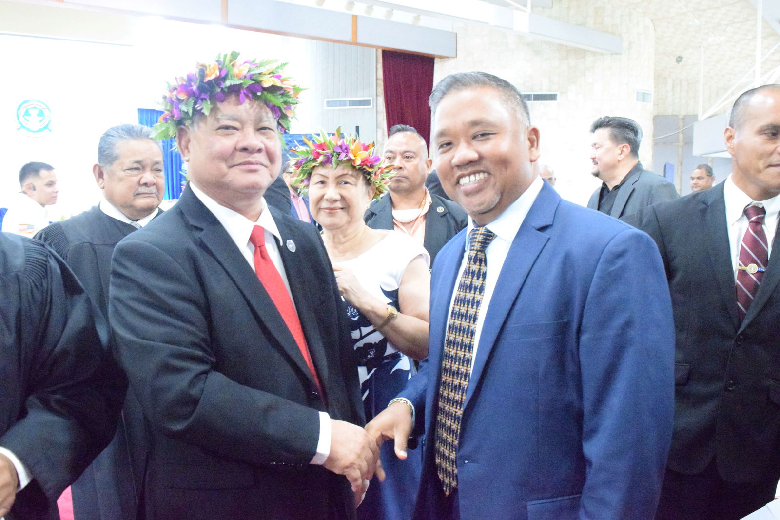 Gov. Arnold I. Palacios and Interior Deputy Assistant Secretary for Insular and International Affairs Angel Demapan shake hands as they pose for a photo after the governor’s State of the Commonwealth Address.